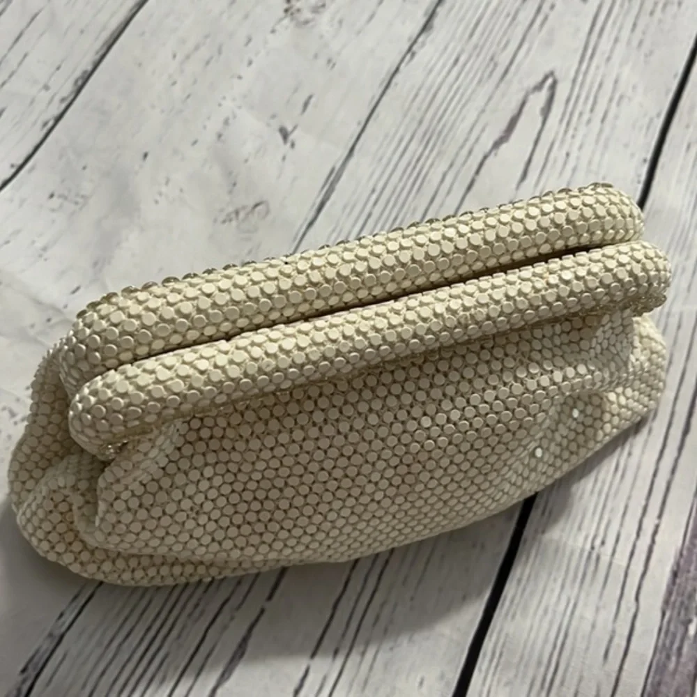 Dainty special occasion clutch with snap hinge closure cream
